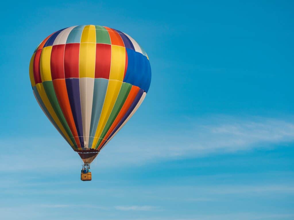 Colorful hot air balloon floating on a clear sunny day