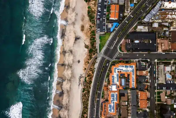 Aerial view of Carlsbad, California, showing the beach and some of the coastal homes.