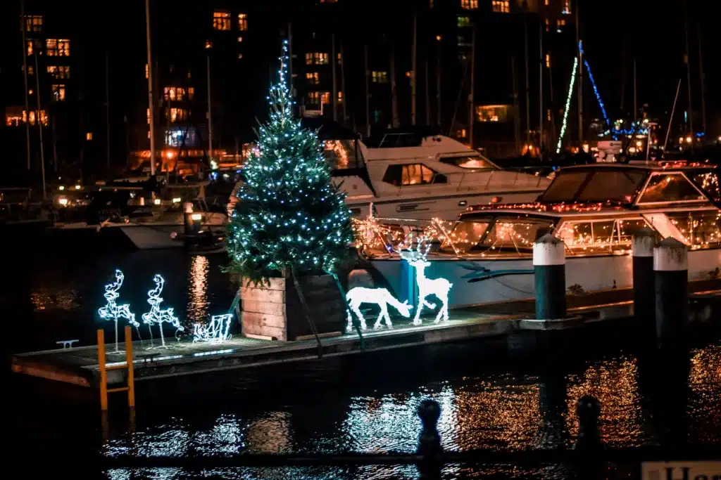 Boats decorated with holiday lights