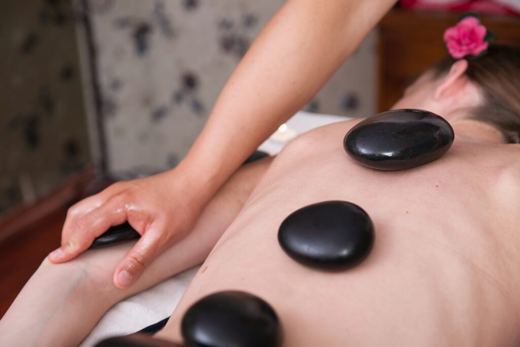 A person enjoying a stone massage