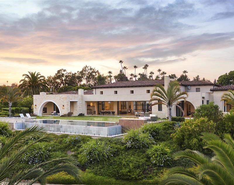 Luxury Estate in Rancho Santa Fe, CA with sprawling pool and elegant facade