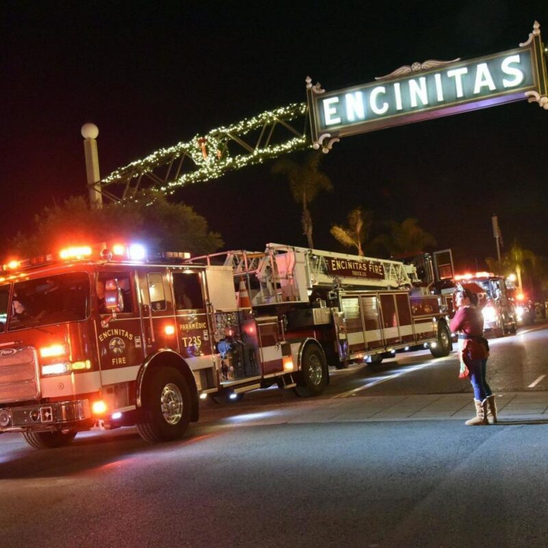 Fire Truck at a Holiday Parade In Encinitas With Men, Women, and Children Watching on the Side